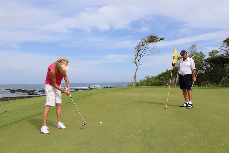 Putting on the green at Hacienda Pinilla Golf Course